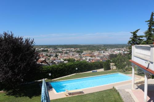 a swimming pool in the yard of a house at B&B Belvedere in Cassano delle Murge