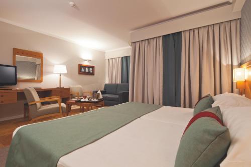 Uma cama ou camas num quarto em Eurotel Altura