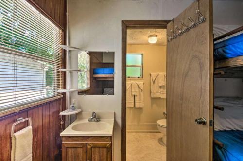 a bathroom with a sink, toilet and shower at Nantahala Cabins in Bryson City