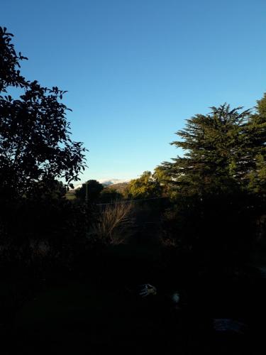 a view of the sky with trees in the background at Cabañas Ñuke Mapu in Villa Ventana