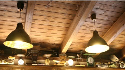 two large lights hanging from the ceiling of a room at Casa Barbadelo in Sarria