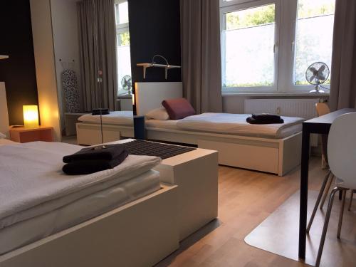 Posteľ alebo postele v izbe v ubytovaní HertenFlats - Rooms & Apartments - Kreis Recklinghausen