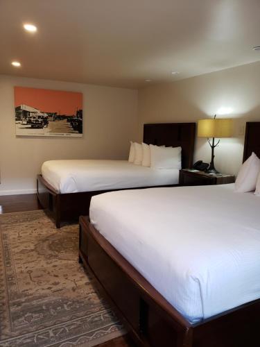 a hotel room with two beds in a room at Iron Horse Inn in Cottonwood
