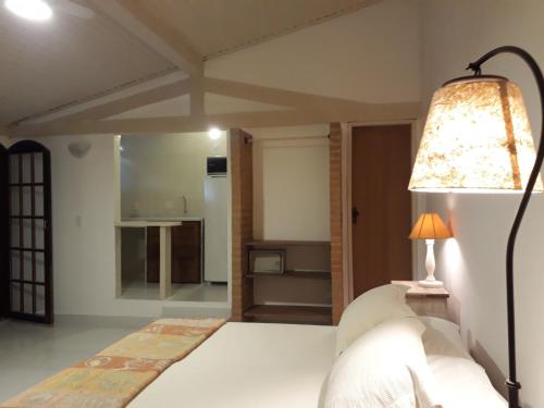 Una cama o camas en una habitación de Vila Shalimar