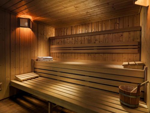 a sauna with a bench in a wooden room at H10 Playa Esmeralda - Adults Only in Costa Calma