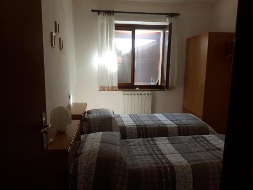 Postel nebo postele na pokoji v ubytování Agriturismo La Selva