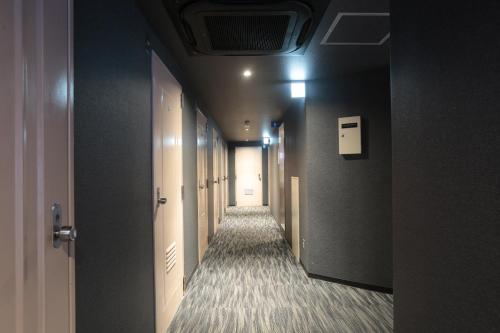 a corridor of a hallway with at Hotel Sunplaza 2 in Osaka