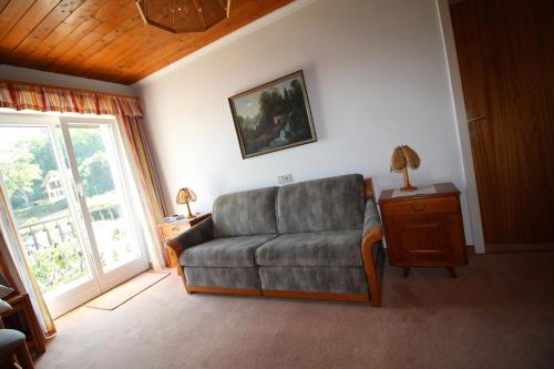 a living room with a couch and a window at Haus Wolfgang in Reifnitz