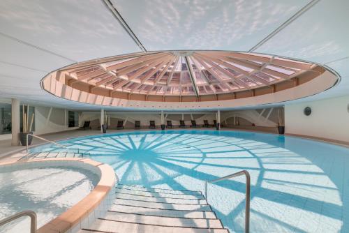 a large swimming pool on a cruise ship at Hapimag Resort Ascona in Ascona