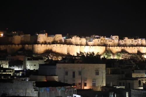 a view of a city at night at Hotel Renuka in Jaisalmer