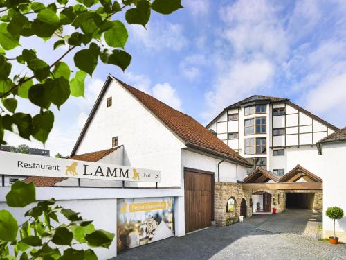 a building with a sign that reads restaurant lamine at Hotel Lamm in Ostfildern