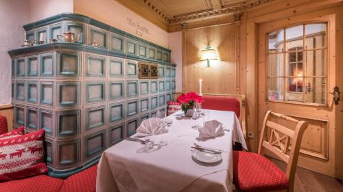a dining room with a table and red chairs at Gasthaus Hotel Adler in Endingen