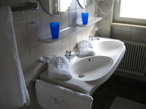 a bathroom with a white sink and a mirror at Haus Anne in Ellmau