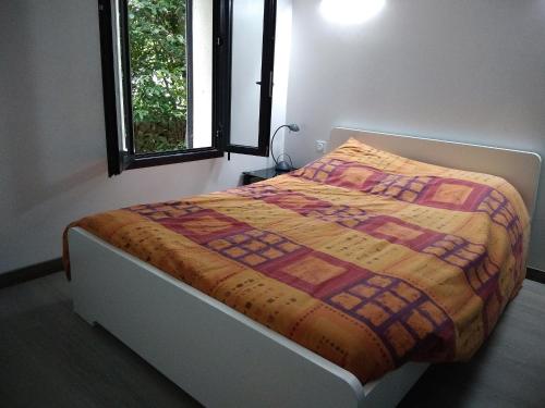 Ένα ή περισσότερα κρεβάτια σε δωμάτιο στο Gîte La Capitelle