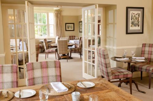 a dining room with a table and chairs at Eltermere Inn in Elterwater