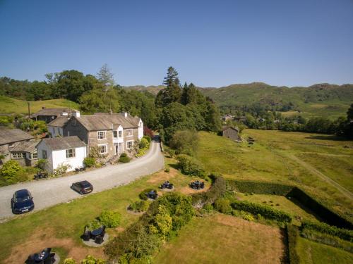 an aerial view of a house and a road at Eltermere Inn in Elterwater