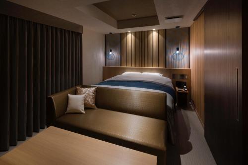 Ένα ή περισσότερα κρεβάτια σε δωμάτιο στο N Hotel