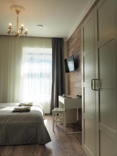Emi apartment tesisinde bir odada yatak veya yataklar