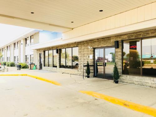 a store front with glass doors on a building at Northern Star Hotel & Convention Center in Slave Lake