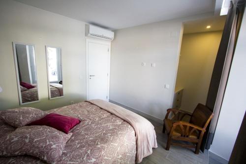 Ένα ή περισσότερα κρεβάτια σε δωμάτιο στο MS Apartamentos, Setúbal