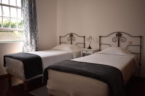 Ένα ή περισσότερα κρεβάτια σε δωμάτιο στο Casa das Ondas