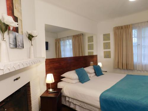 En eller flere senge i et værelse på Hotel 7 Norte