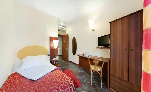 Posteľ alebo postele v izbe v ubytovaní Antico Albergo Madonna