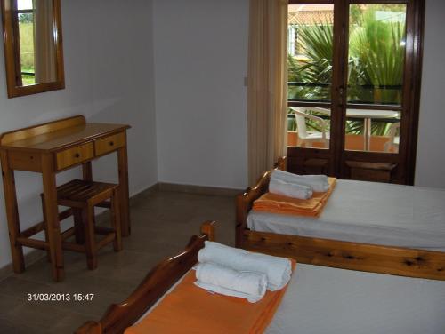 Ένα ή περισσότερα κρεβάτια σε δωμάτιο στο Feakes Apartments