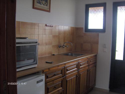 Η κουζίνα ή μικρή κουζίνα στο Feakes Apartments