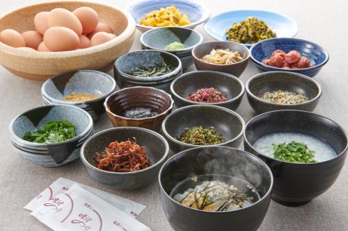 a group of bowls filled with at HOTEL VISCHIO AMAGASAKI by GRANVIA in Amagasaki