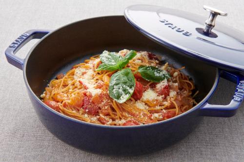 a pan of pasta with basil on top of it at HOTEL VISCHIO AMAGASAKI by GRANVIA in Amagasaki