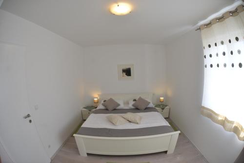 Posteľ alebo postele v izbe v ubytovaní Apartment Lavanda Ruzmarin