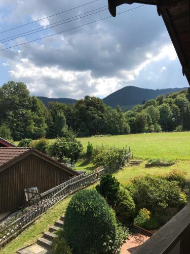 a view of a field from a house at Hotel am Wiesenhang - Garni in Bad Kohlgrub
