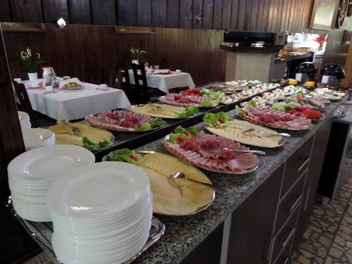 a buffet line with many plates of food on at Sylwia in Szklarska Poręba