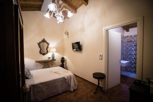 Ein Bett oder Betten in einem Zimmer der Unterkunft Podere Zampiera Vecchia