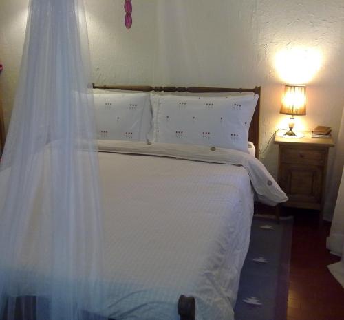 Ένα ή περισσότερα κρεβάτια σε δωμάτιο στο Casita de Piedra B&B