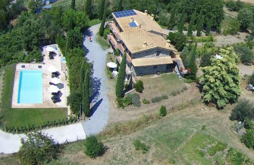 an aerial view of a house with a river at Fattoria Capobianco in Montefiascone