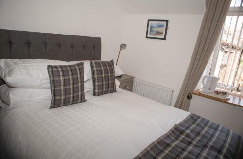 Postel nebo postele na pokoji v ubytování By The Bay