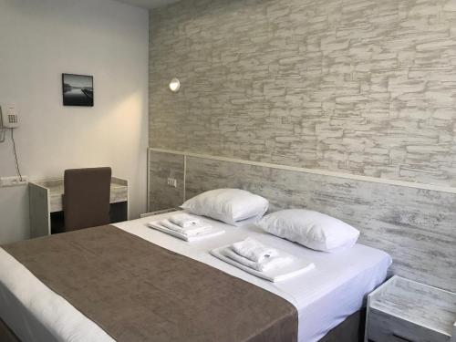 Postel nebo postele na pokoji v ubytování Hobby Hotel