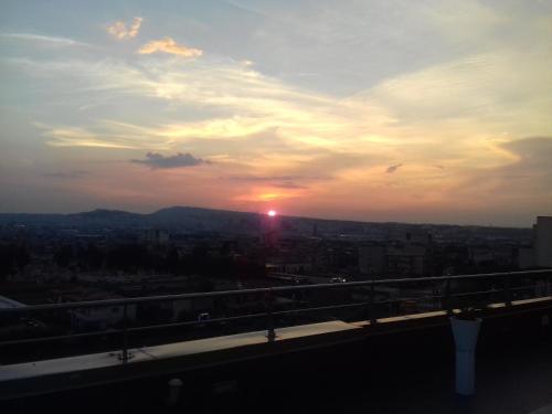 a sunset from the top of a building at Palazzo del Mare in Naples