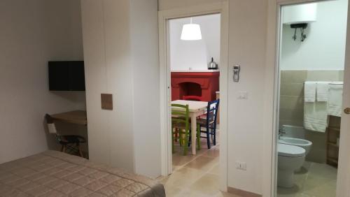 TV a/nebo společenská místnost v ubytování GH Dimora Sant'Anna-Lofts & Apartments