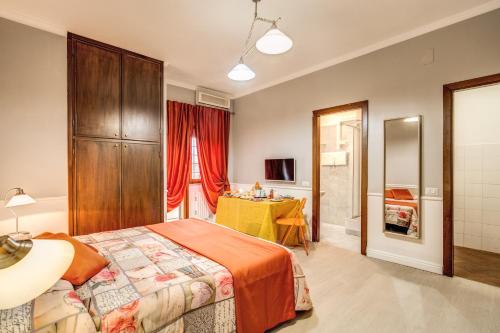 a bedroom with a large bed and a bathroom at Hotel Residence Magnolia in Rome
