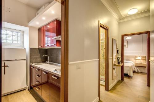 a kitchen with a sink and a counter top at Hotel Residence Magnolia in Rome