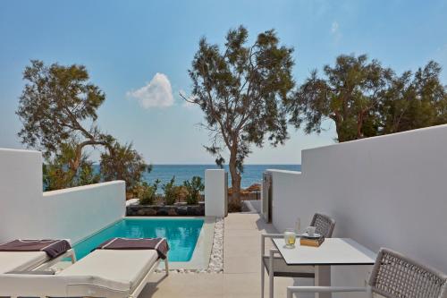 a view of the pool and ocean from a villa at Costa Grand Resort & Spa in Kamari