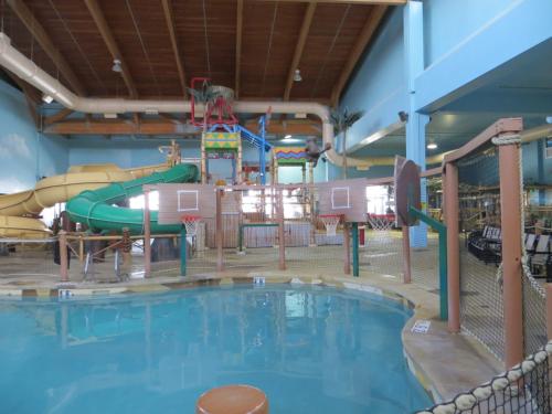 a large indoor water park with a water slide at Canad Inns Destination Center Grand Forks in Grand Forks