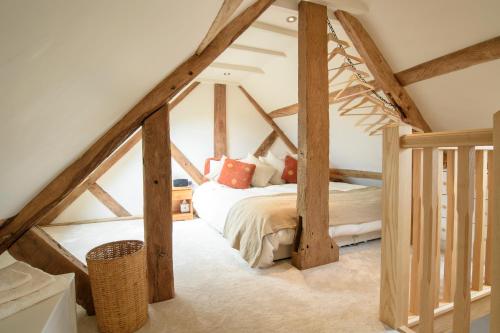 a bedroom with a bed in a attic at The Apple Loft in Ludlow