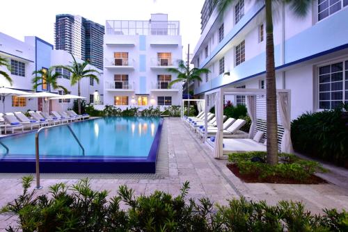 a swimming pool in front of a building at Pestana South Beach Hotel in Miami Beach