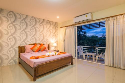 Ένα ή περισσότερα κρεβάτια σε δωμάτιο στο Alisa Krabi Hotel-SHA Plus