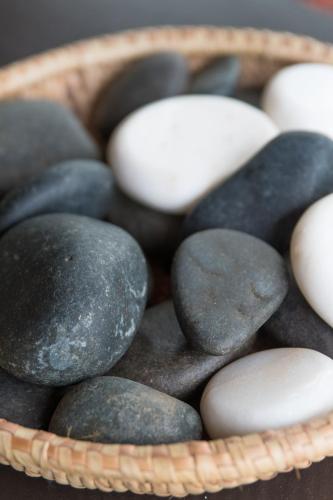 a basket of rocks and eggs on a table at Toro Yaka Bush Lodge in Hoedspruit