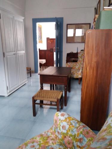 a living room with couches and a table at Appartamento in palazzina storica / Oberdan Suites in Alberobello
